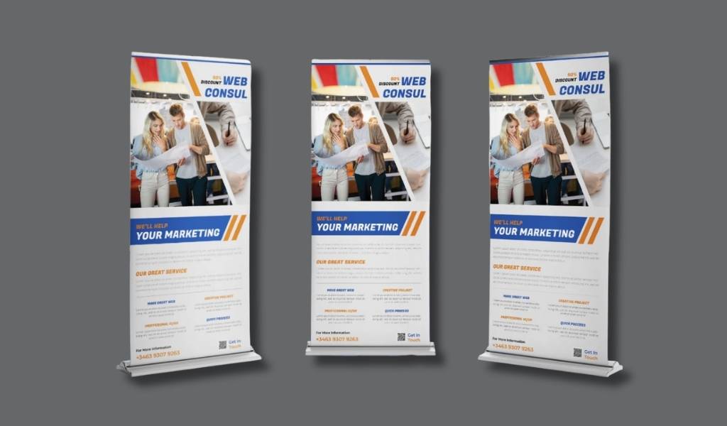 Branded roll-up banner set up at a small business event stand
