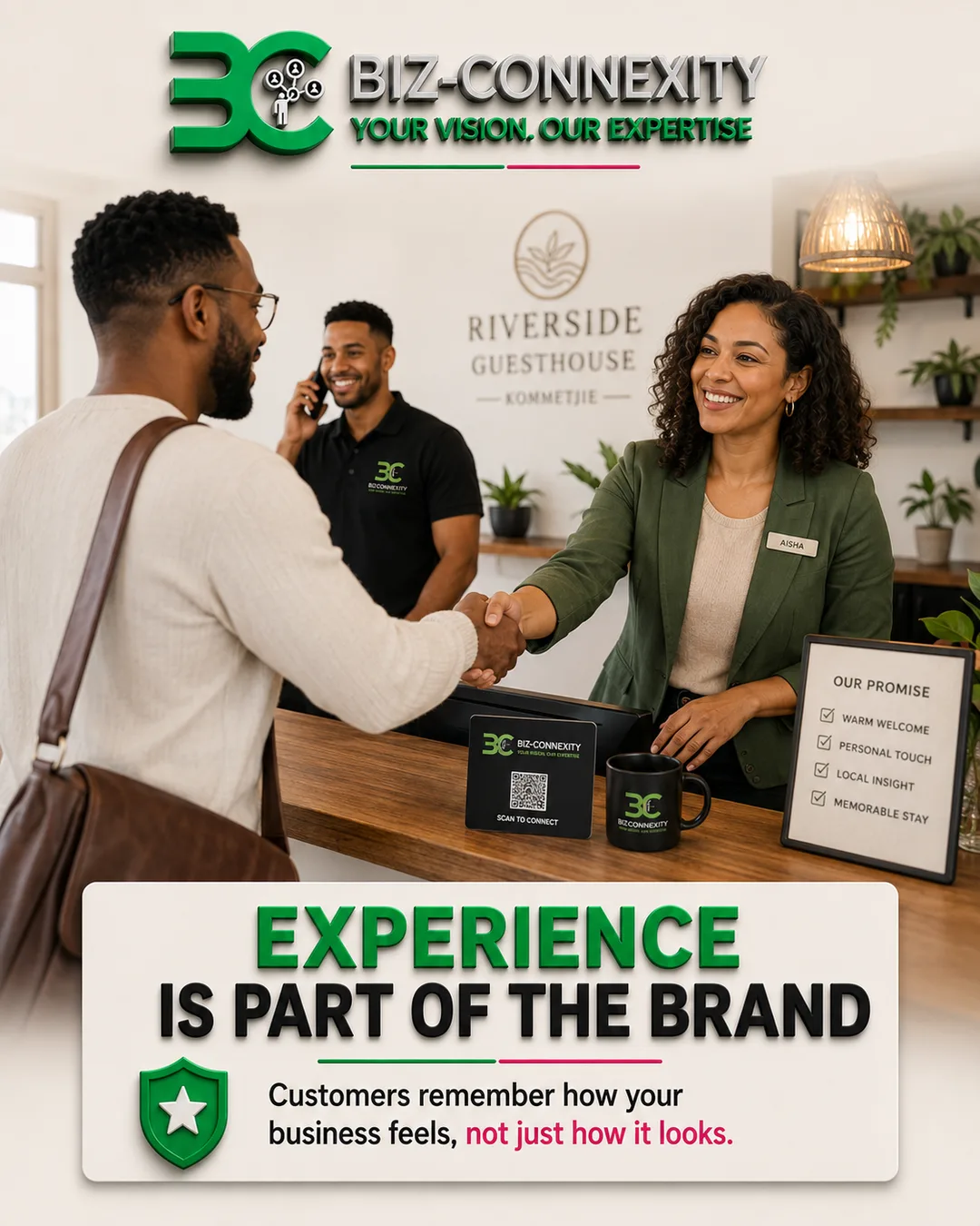 Guesthouse receptionist welcoming a guest at a branded reception desk, showing customer experience as part of the brand