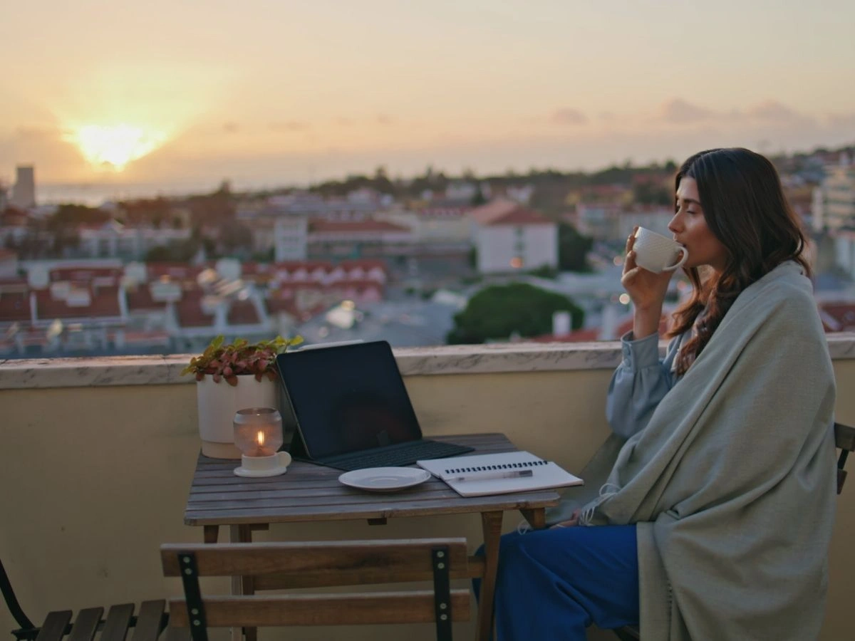 Entrepreneur working early at sunrise on her small business